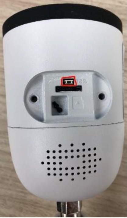 bottom of camera showing reset button